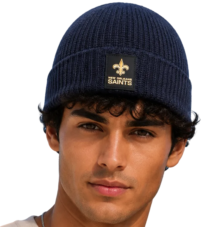 Two models wearing matching navy blue knit beanie hats with a gold fleur-de-lis and the word 'SAINTS' on the front, shown against a plain white background.