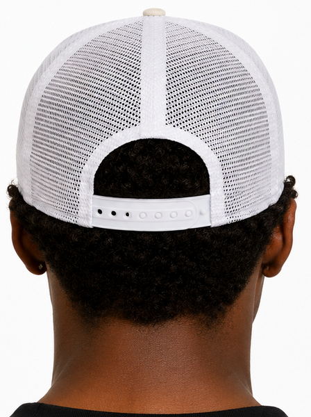 A man shown from the front and back wearing a New Era New York Yankees trucker hat. The hat features a cream-colored front panel with the white embroidered New York Yankees logo, white mesh back panels, and a white visor with a black New Era sticker.