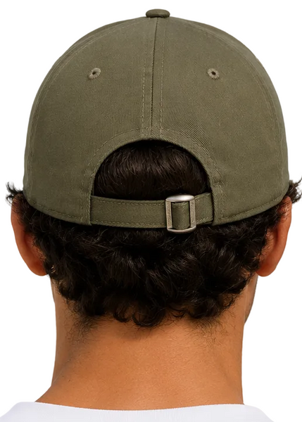 Two people shown from behind wearing matching olive green baseball caps with adjustable back straps, set against a clear blue sky.